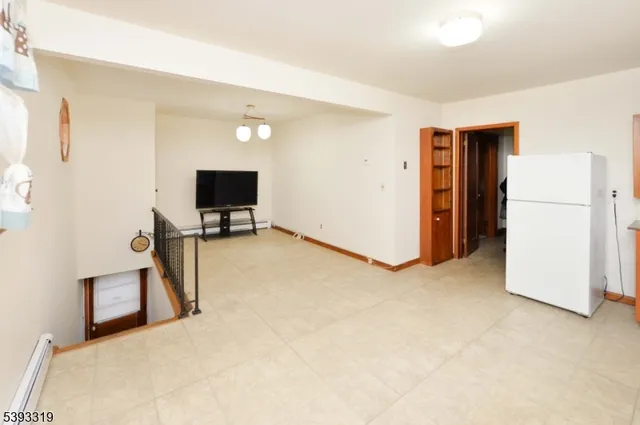 a view of a livingroom with a flat screen tv