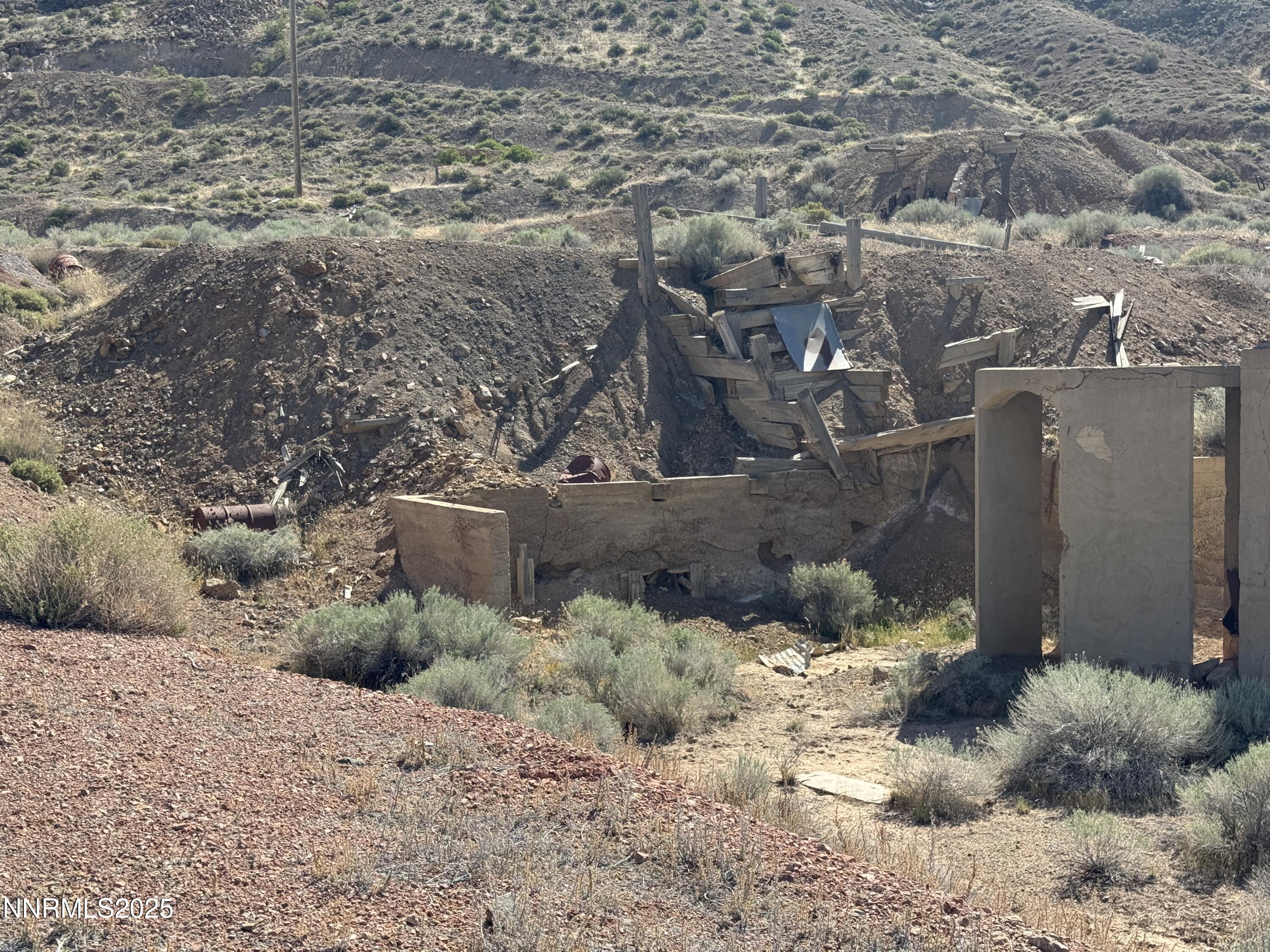 1508012 Coal Canyon Road Lovelock, NV 89419 - Photo 3 of 40 a view of a dry yard with wooden fence