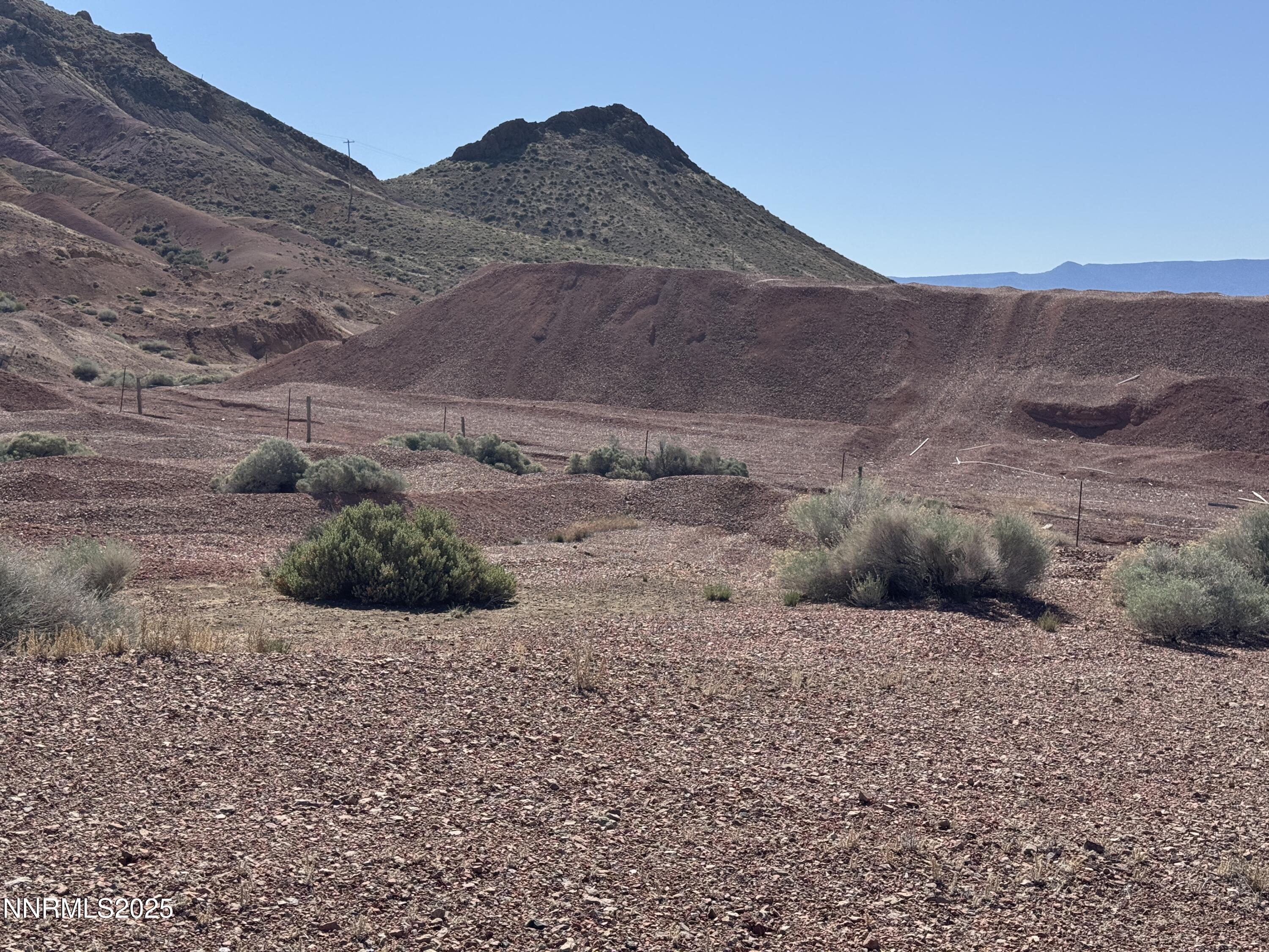 1508012 Coal Canyon Road Lovelock, NV 89419 - Photo 38 of 40 a view of a dry yard with mountains in the background