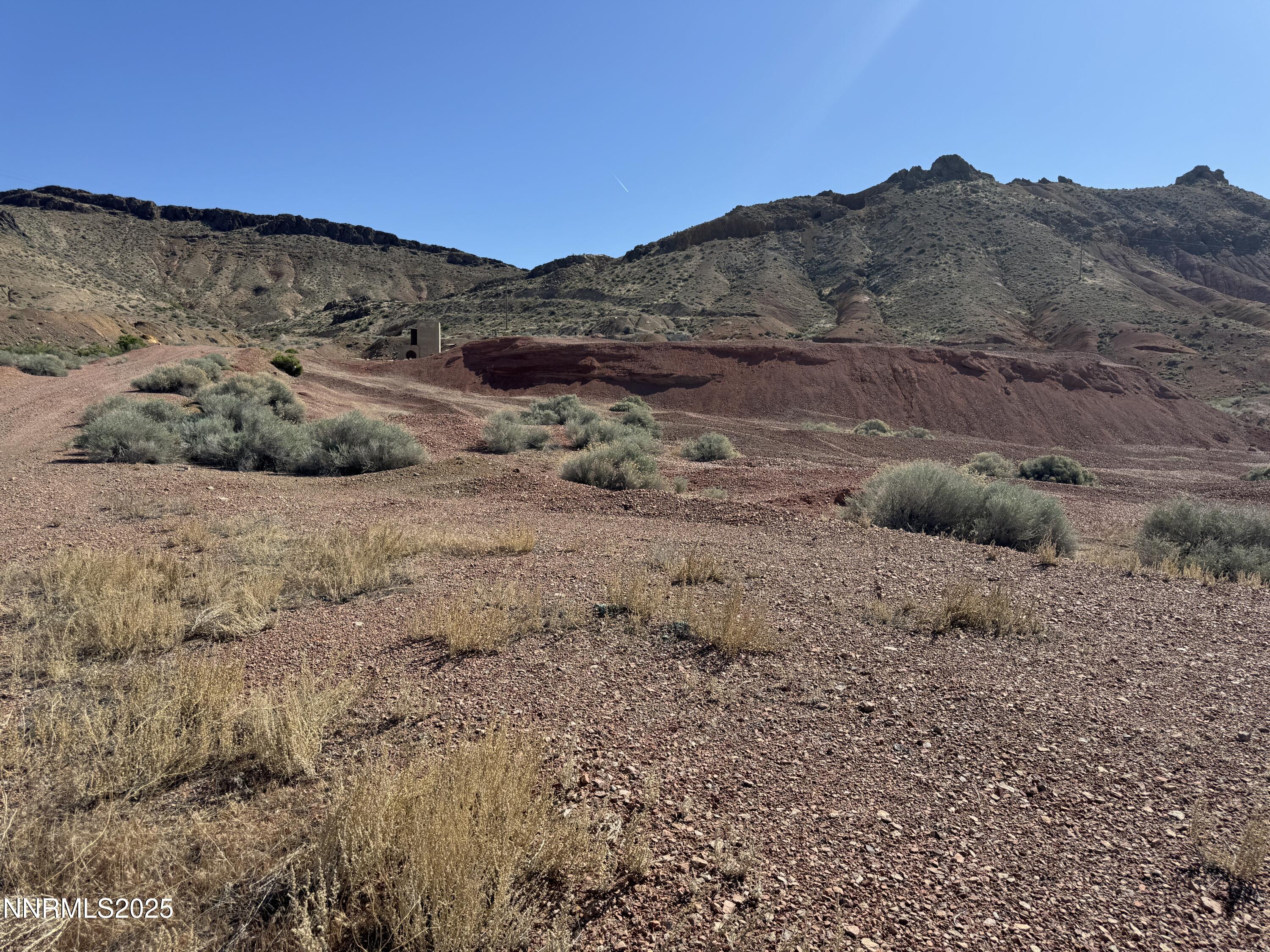 1508012 Coal Canyon Road Lovelock, NV 89419 - Photo 39 of 40 a view of a dry field with mountains in the background
