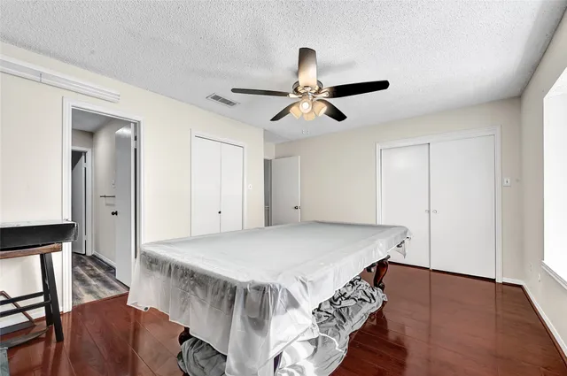 a view of empty room with a window and fireplace