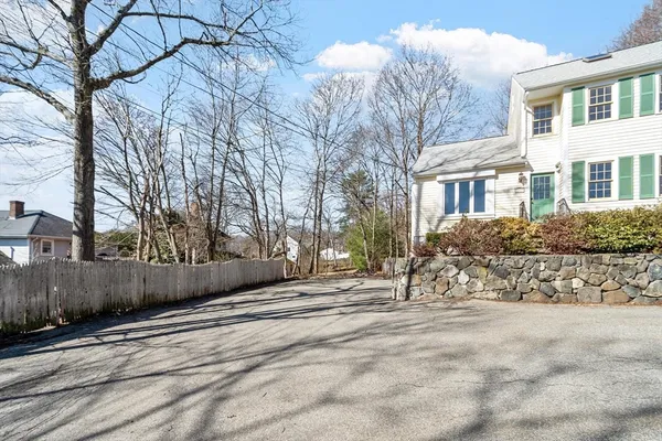 a view of road with with wooden fence