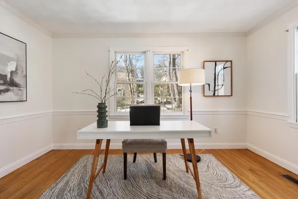 a workspace with furniture and wooden floor