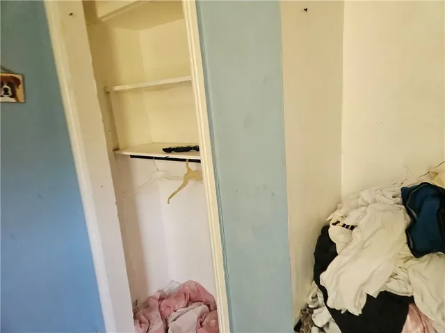 a view of a hallway with closet