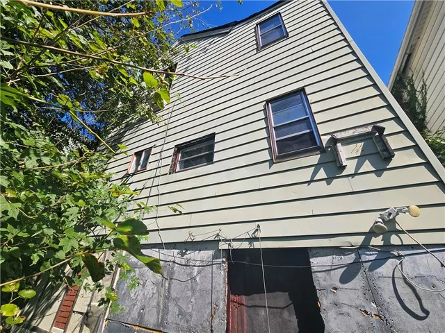 a view of a room with furniture and windows