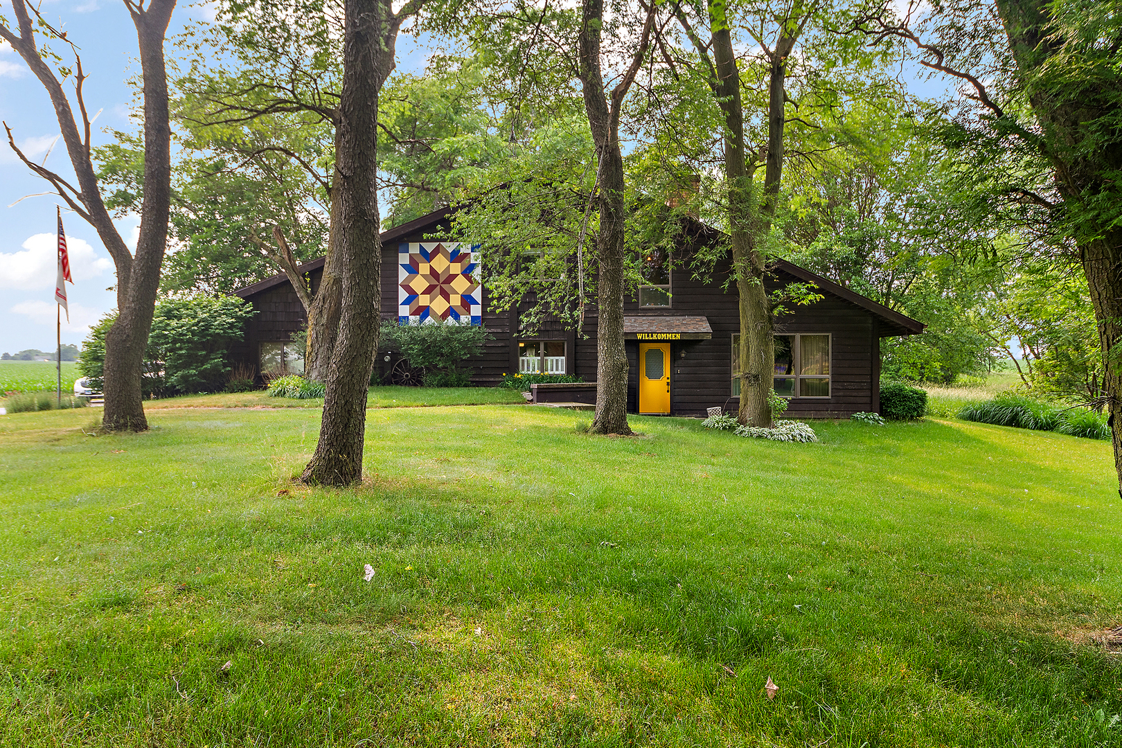 32444 Wilton Road Manhattan, IL 60442 - Photo 1 of 28 a view of a house with a backyard and a tree