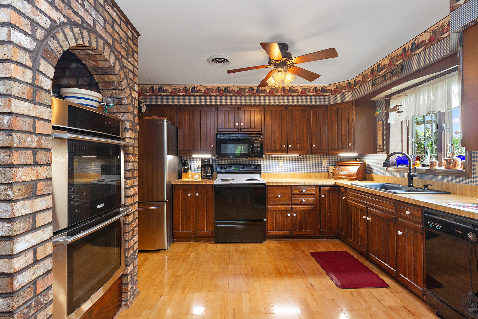 32444 Wilton Road Manhattan, IL 60442 - Photo 12 of 28 a kitchen with stainless steel appliances granite countertop a stove and a sink