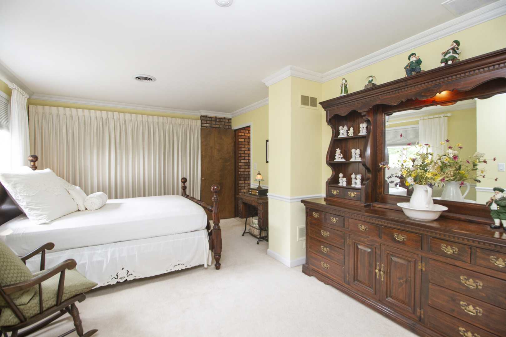 32444 Wilton Road Manhattan, IL 60442 - Photo 18 of 28 a bedroom with a bed dresser and a window