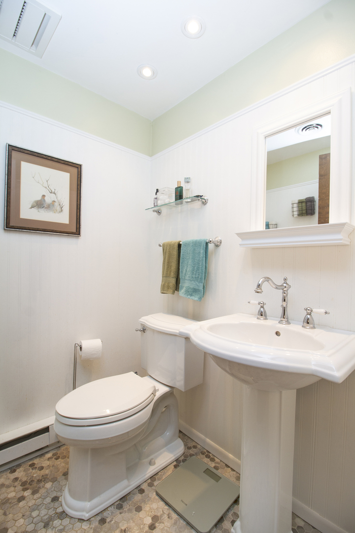 32444 Wilton Road Manhattan, IL 60442 - Photo 19 of 28 a bathroom with a toilet a sink and mirror