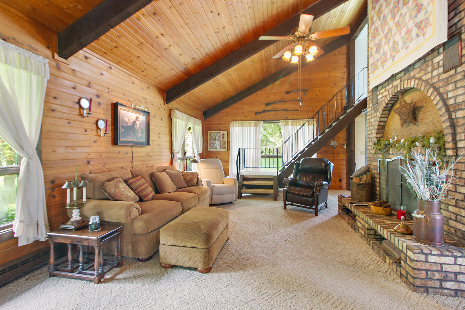 32444 Wilton Road Manhattan, IL 60442 - Photo 4 of 28 a living room with furniture a fireplace and a large window