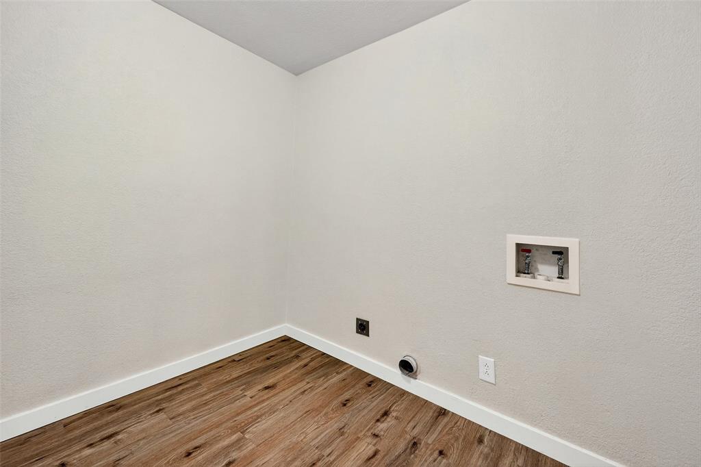 218 Kansas Street Sherman, TX 75090 - Photo 19 of 22 a view of an empty room with wooden floor