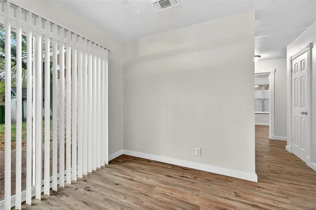 a view of wooden floor and brick walls