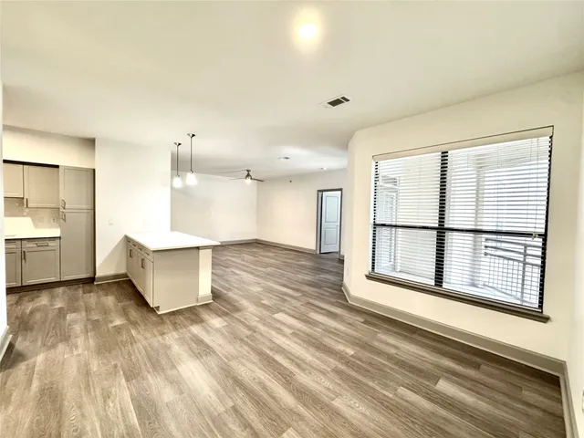 a view of a kitchen with a sink and cabinets