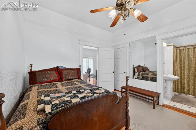 a bed room with a bed and a chandelier