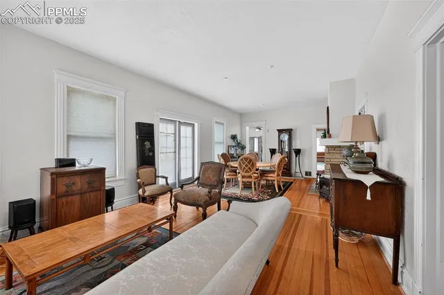 a living room with furniture fireplace and flat screen tv