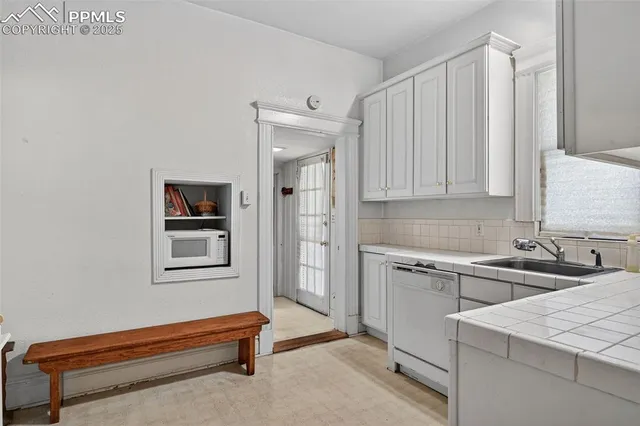 a room with a sink and a window