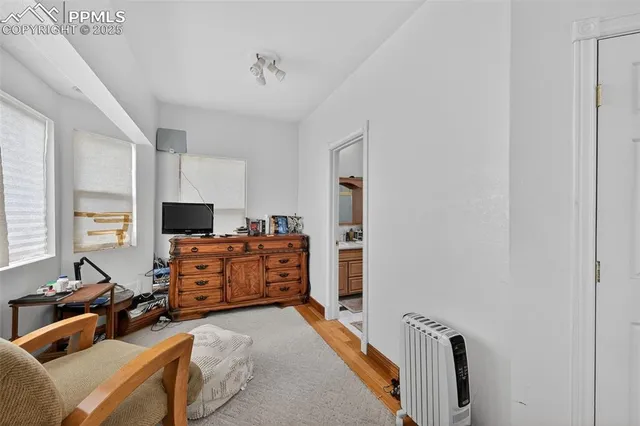 a bathroom with a granite countertop sink a mirror a shower and a bathtub