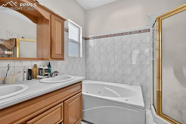 a bathroom with a bathtub and a sink