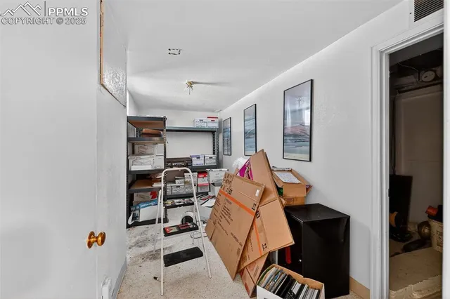 a view of a house with a yard covered in snow