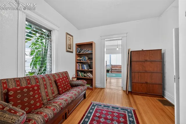 a living room with furniture and a rug