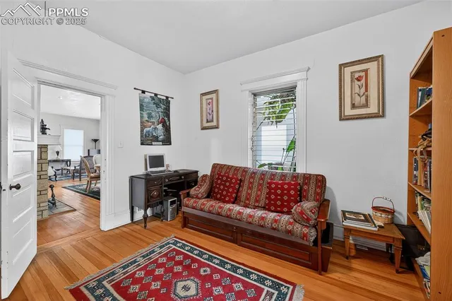 a living room with furniture and a rug