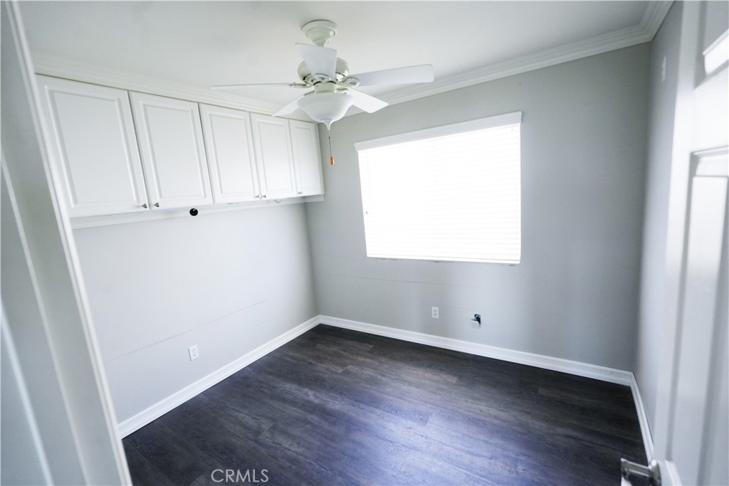 1464 Augusta Street Beaumont, CA 92223 - Photo 19 of 32 an empty room with wooden floor and windows