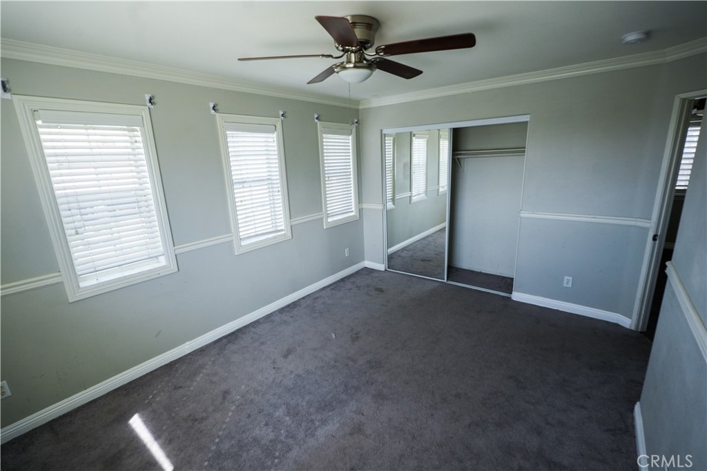1464 Augusta Street Beaumont, CA 92223 - Photo 26 of 32 a view of a livingroom with a ceiling fan and window