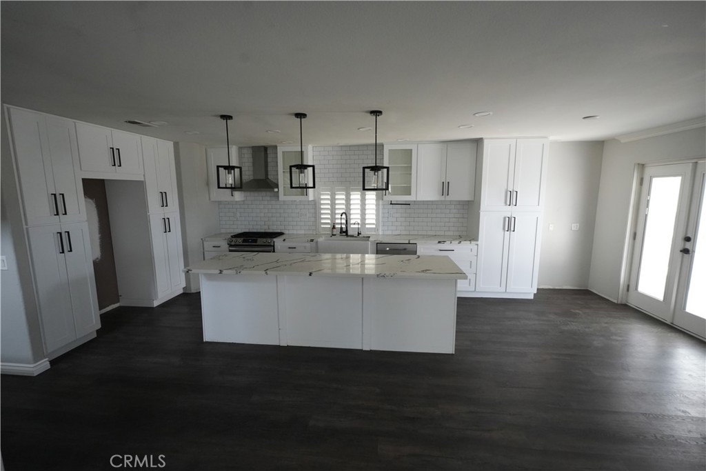 1464 Augusta Street Beaumont, CA 92223 - Photo 6 of 32 a view living room with stainless steel appliances kitchen island granite countertop a refrigerator and a stove