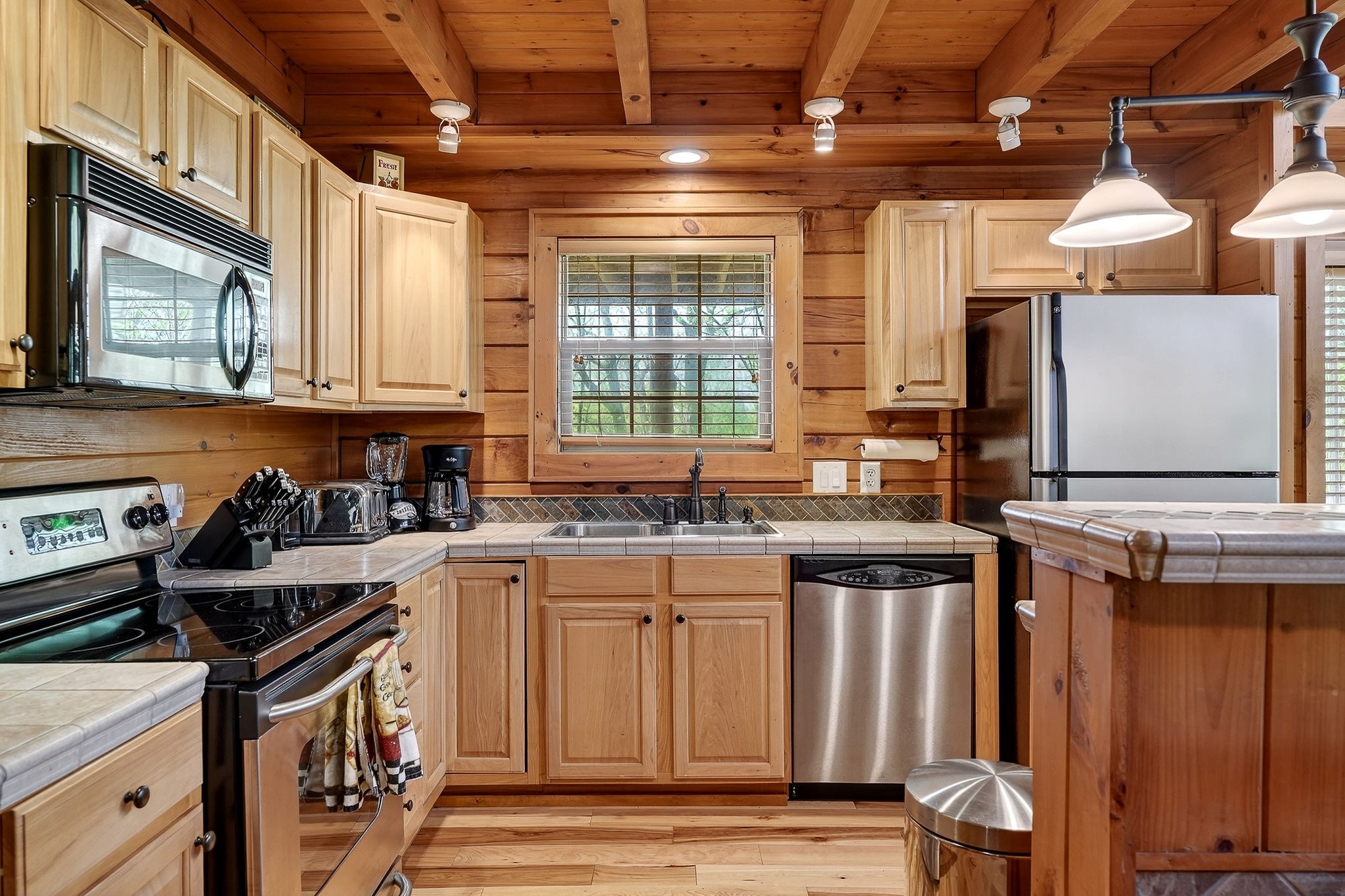 5175 Dale Ridge Road Liberty, TN 37095 - Photo 12 of 69 a kitchen with stainless steel appliances granite countertop a stove a sink and a microwave
