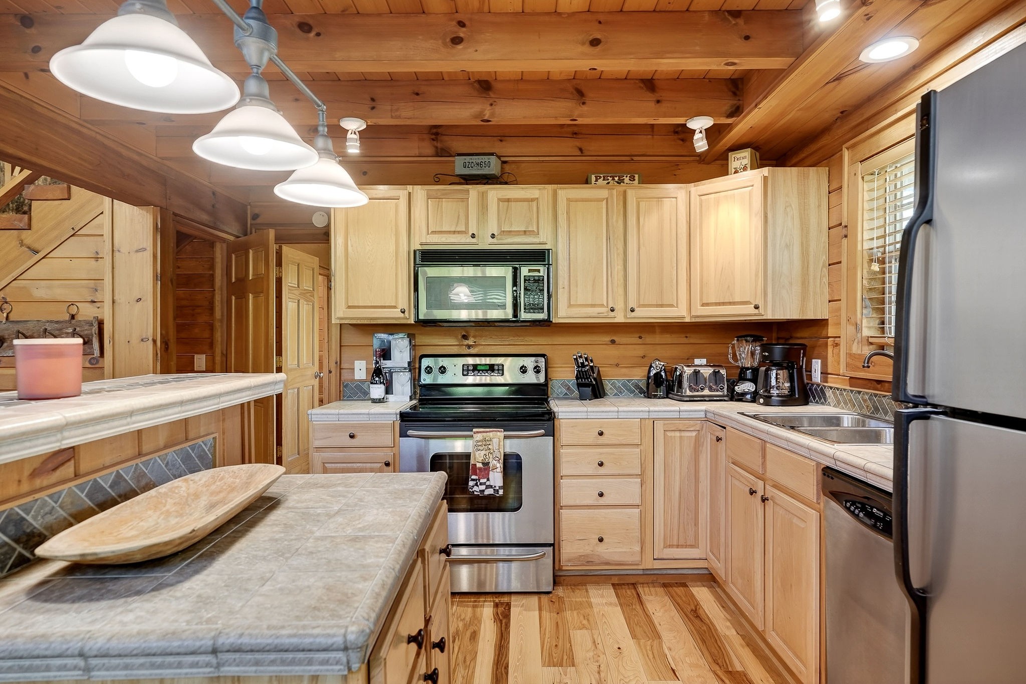 5175 Dale Ridge Road Liberty, TN 37095 - Photo 10 of 69 a kitchen with stainless steel appliances kitchen island granite countertop a sink cabinets and wooden floor