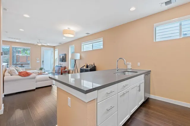 a view of living room with granite countertop furniture and fireplace