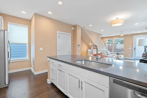 a kitchen with sink and cabinets