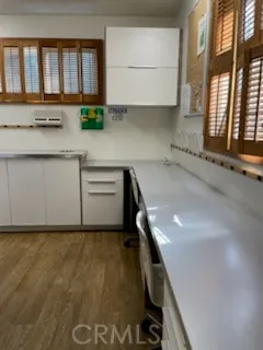 a view of a kitchen with a sink and a window