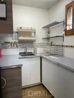a kitchen with a sink and a stove