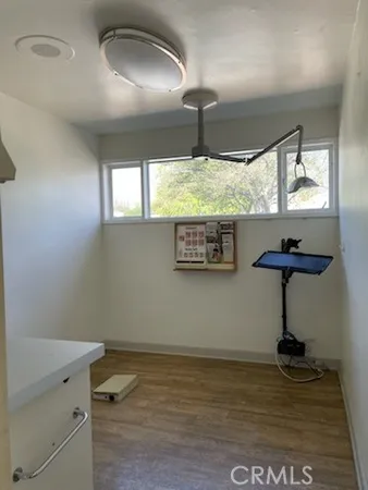 a view of room with window and furniture