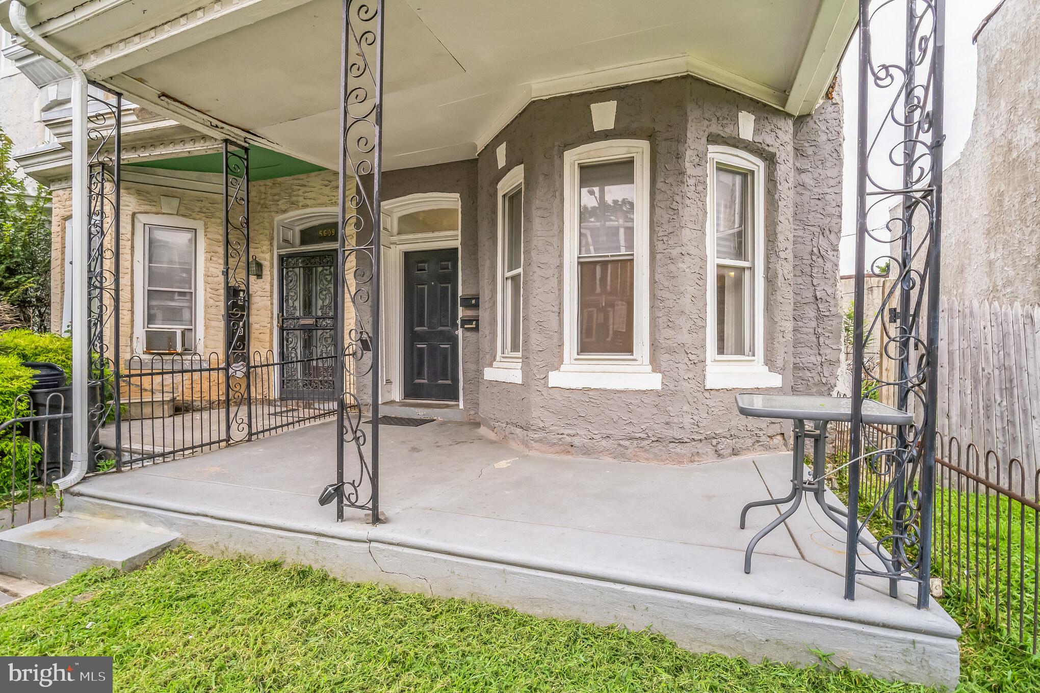 5607 Baynton Street Philadelphia, PA 19144 - Photo 1 of 18 a front view of a house with garden