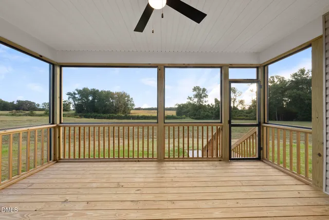 a view of a balcony with wooden floor