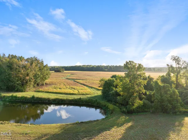 a view of a lake with a yard