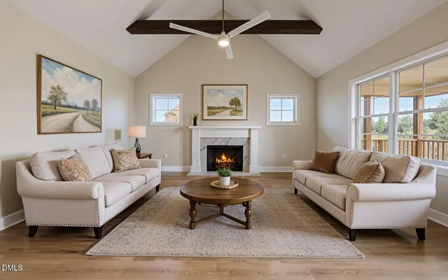 a living room with furniture and a fireplace