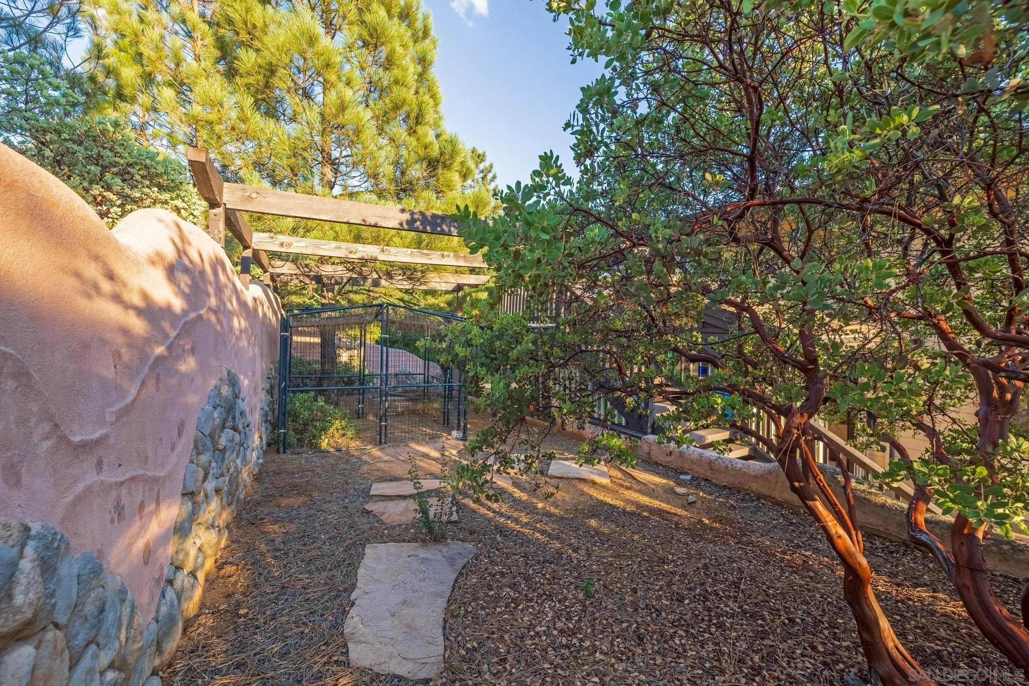 5222 Pine Hills Road Julian, CA 92036 - Photo 25 of 37 Retaining walls with stones and outlines of the mountains