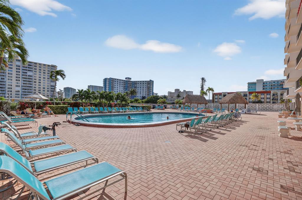405 North Ocean Boulevard, Unit 1027 Pompano Beach, FL 33062 - Photo 16 of 57 a view of a terrace with lawn chairs