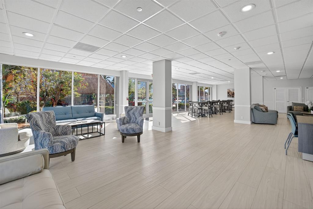 405 North Ocean Boulevard, Unit 1027 Pompano Beach, FL 33062 - Photo 26 of 57 a lobby with furniture and floor to ceiling window