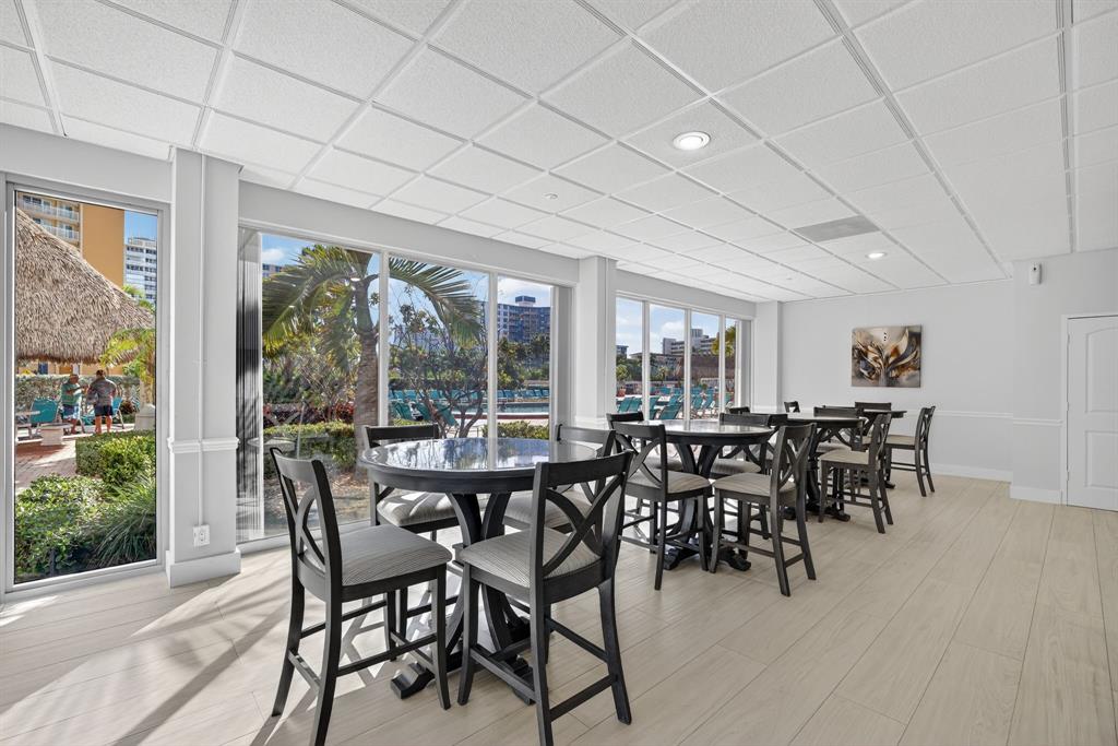 405 North Ocean Boulevard, Unit 1027 Pompano Beach, FL 33062 - Photo 28 of 57 a view of a dining room with furniture window and outside view