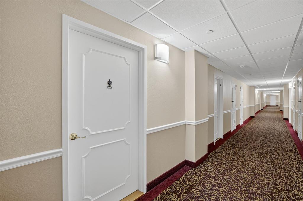 405 North Ocean Boulevard, Unit 1027 Pompano Beach, FL 33062 - Photo 34 of 57 a view of hallway with stairs