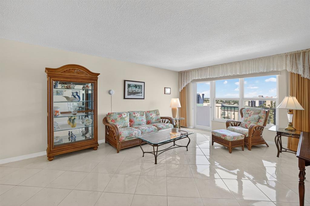 405 North Ocean Boulevard, Unit 1027 Pompano Beach, FL 33062 - Photo 36 of 57 a living room with furniture and large window