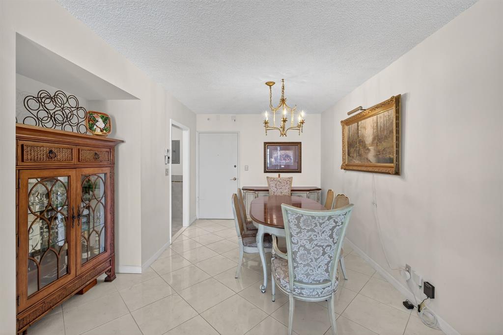 405 North Ocean Boulevard, Unit 1027 Pompano Beach, FL 33062 - Photo 39 of 57 a dining room with furniture and window