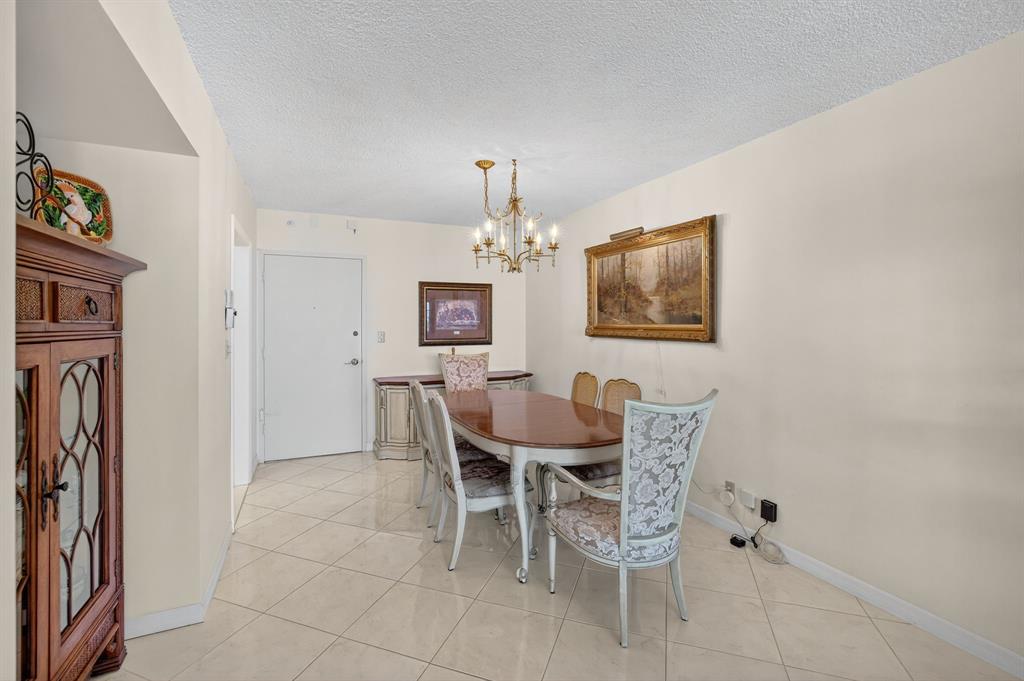 405 North Ocean Boulevard, Unit 1027 Pompano Beach, FL 33062 - Photo 40 of 57 a dining room with furniture and window