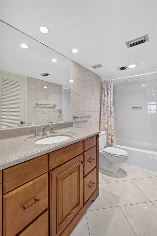 405 North Ocean Boulevard, Unit 1027 Pompano Beach, FL 33062 - Photo 46 of 57 a bathroom with a granite countertop sink toilet and shower