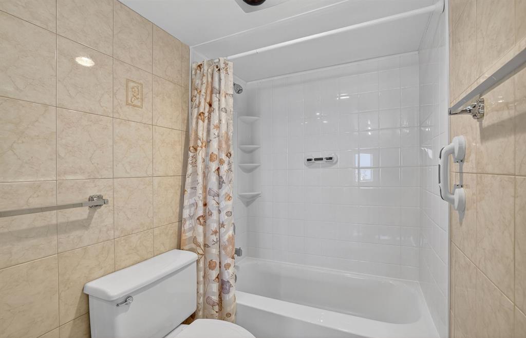 405 North Ocean Boulevard, Unit 1027 Pompano Beach, FL 33062 - Photo 47 of 57 a bathroom with a shower and a toilet
