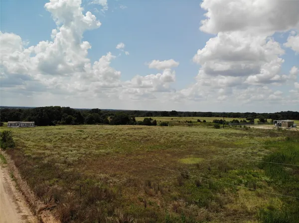 a view of a field with lots of green space
